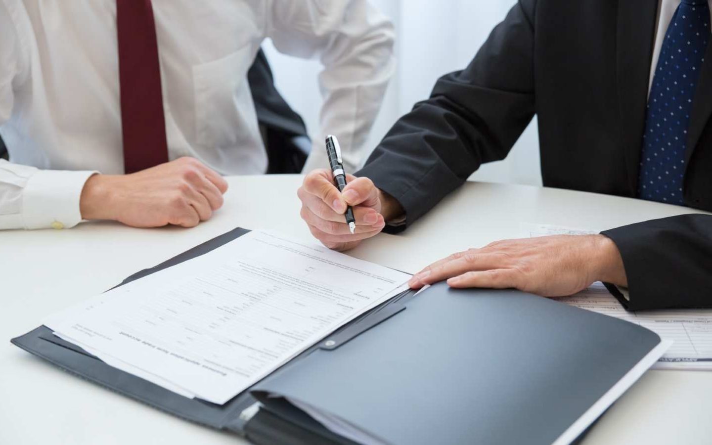 person signing a document